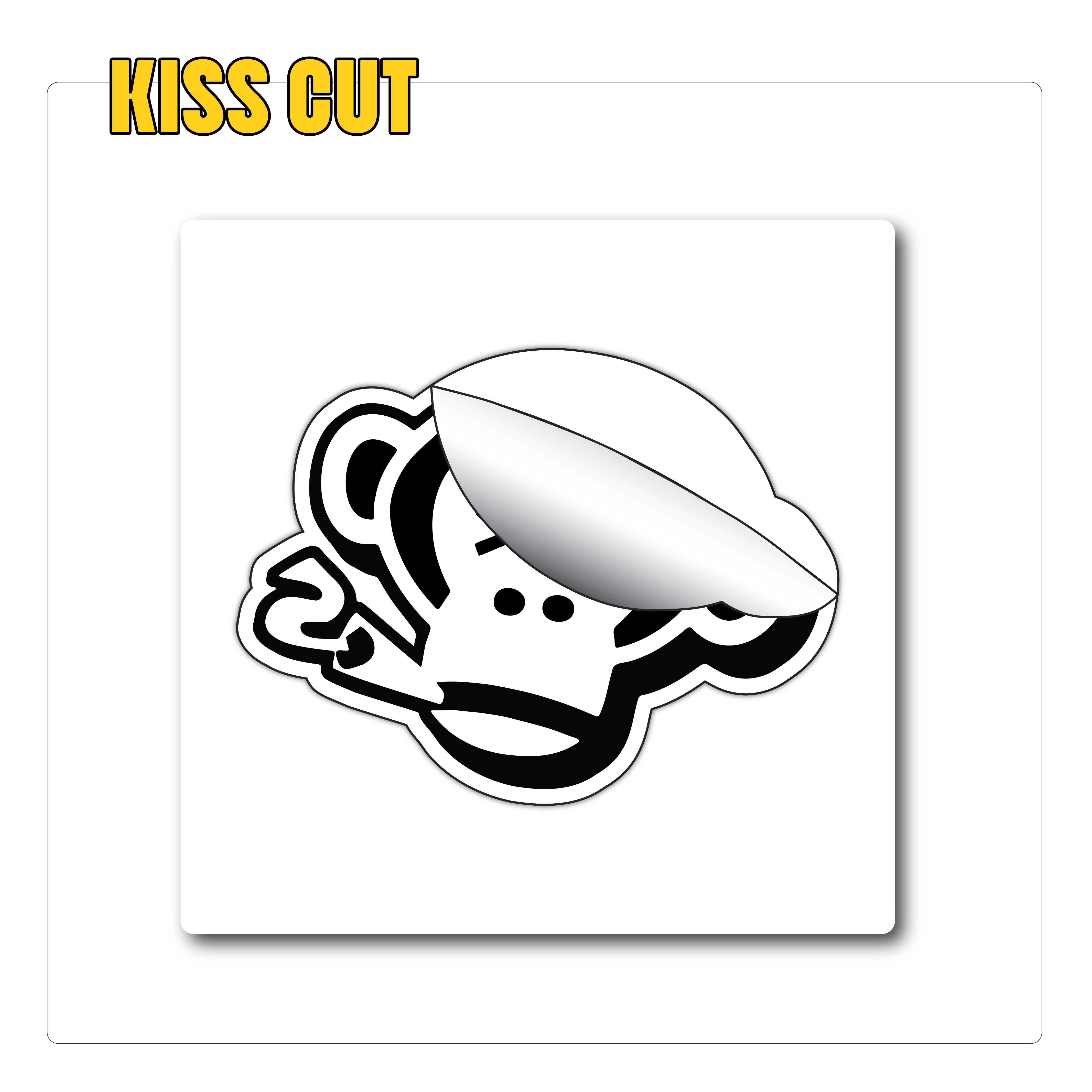 Black and white monkey sticker with a pipe, partially peeled off. Yellow text reads "Kiss Cut" above. Playful and fun tone.